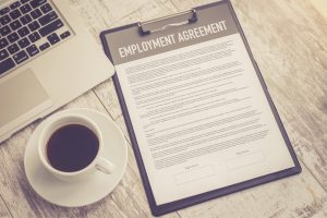 Employee reviewing an arbitration agreement before pursuing a wrongful termination claim